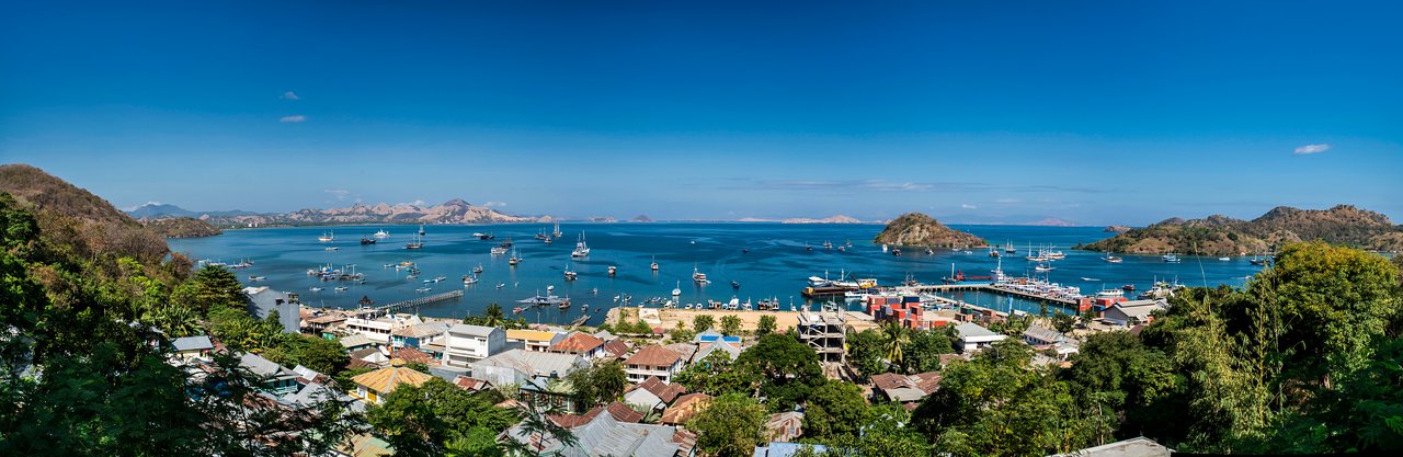 Boats moored in Labuan Bajo harbour at dusk, Flores