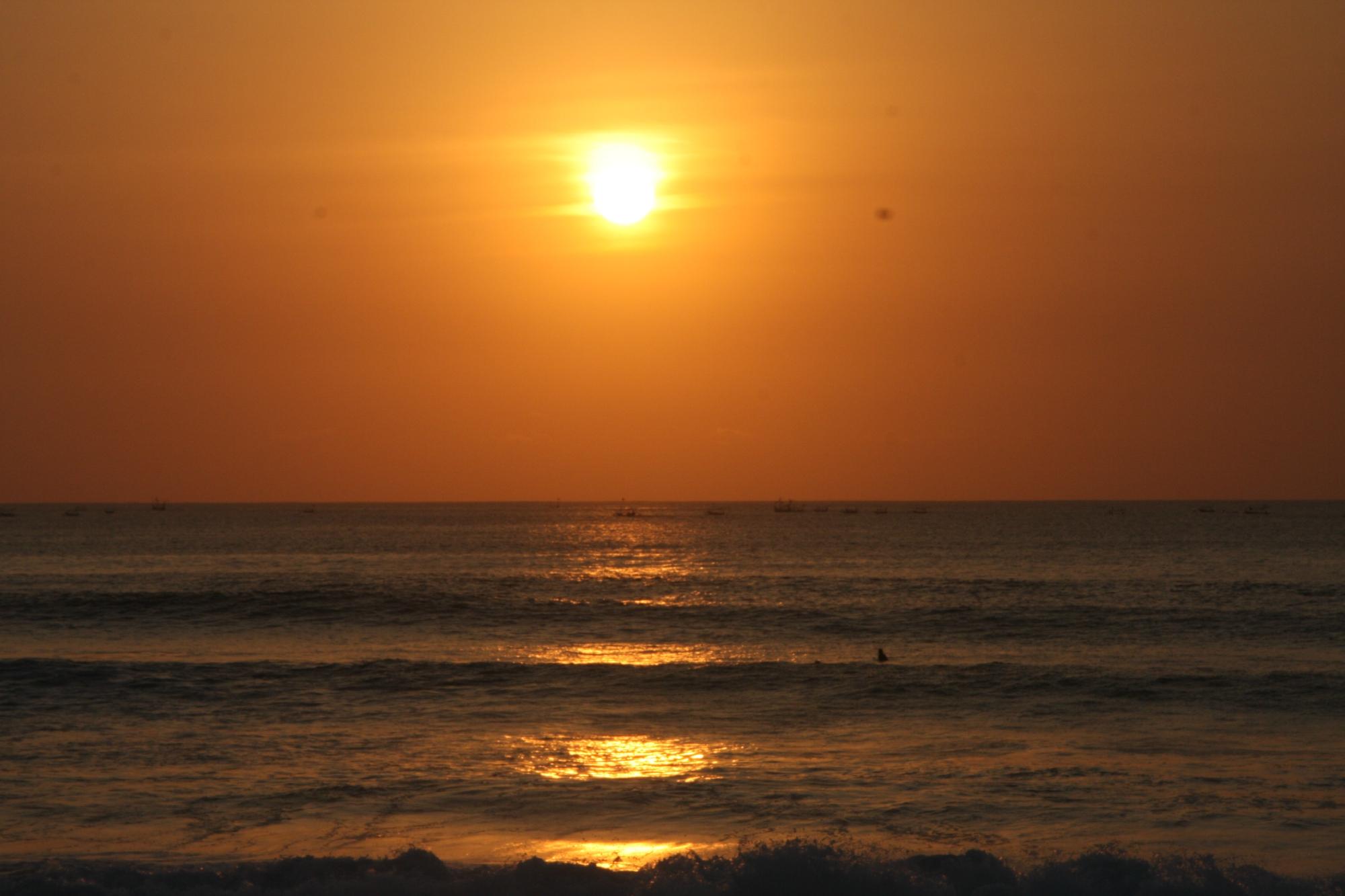 Sunset over the surf break at Lakey Peak, Sumbawa