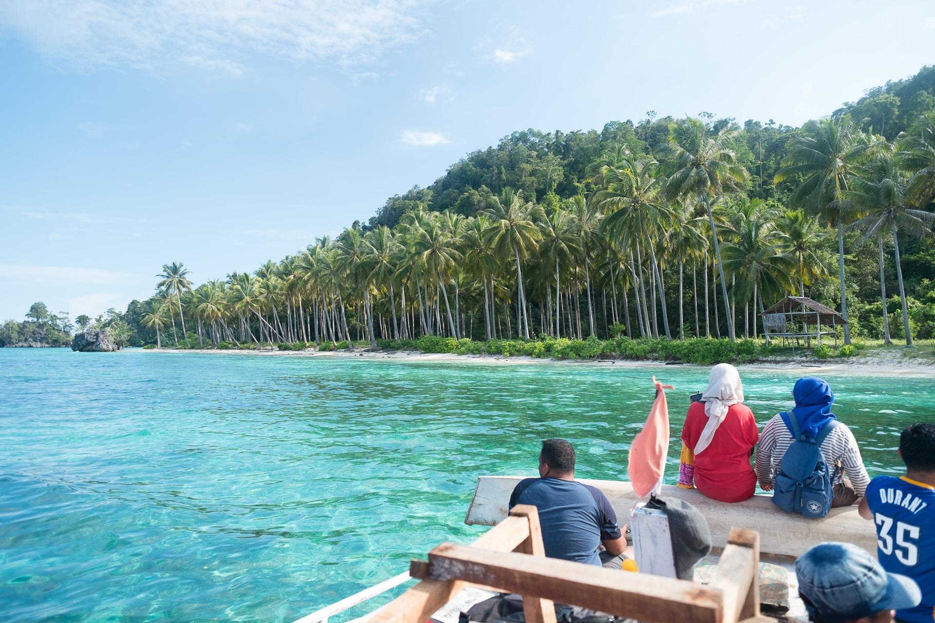 A small boat on the turquoise water of the Labengki islands, Southeast Sulawesi
