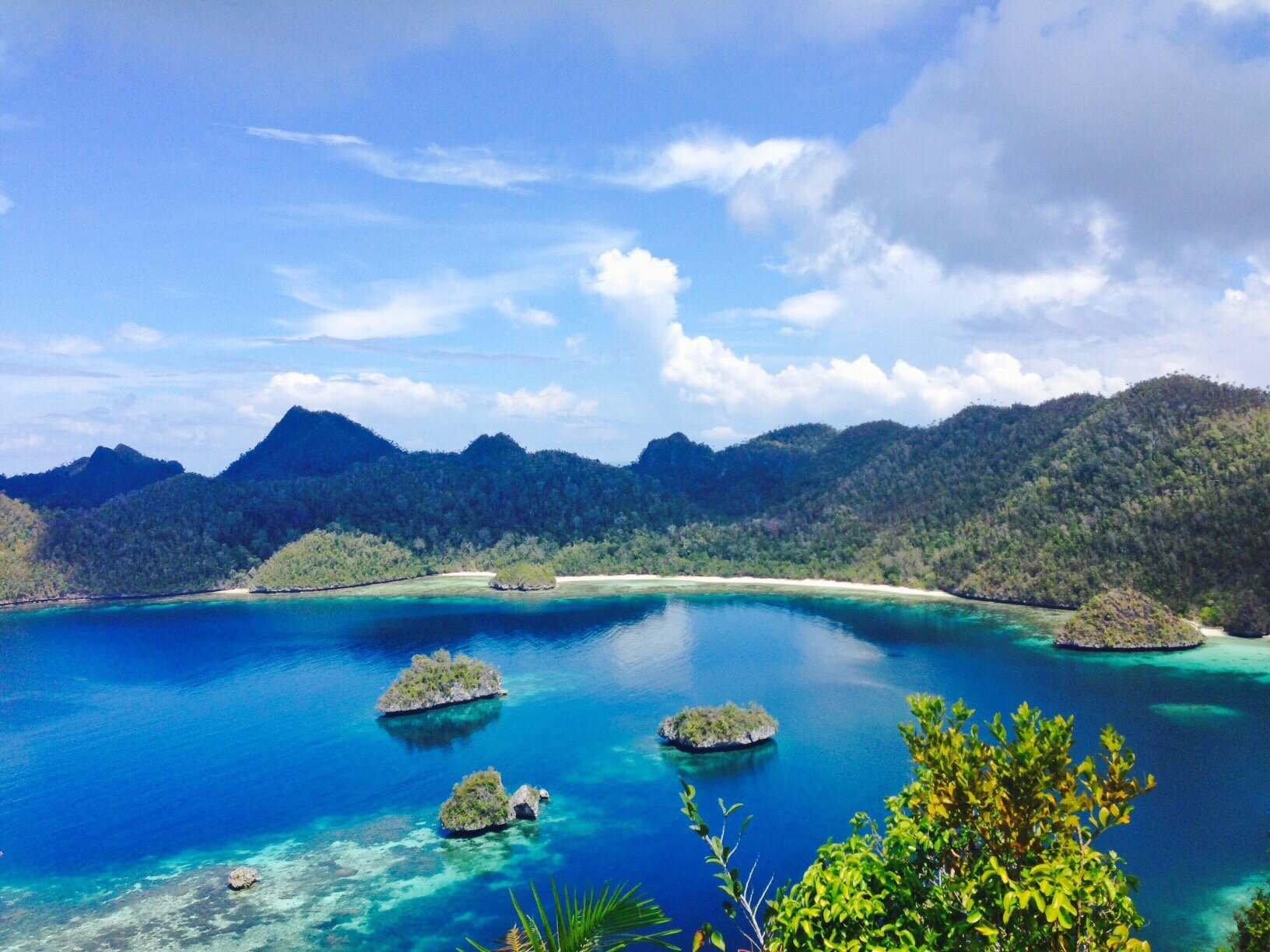 Jungle-covered karst peaks above a lagoon at Wayag, Raja Ampat